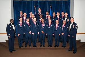 Airmen Leadership School graduates pose for a photo.