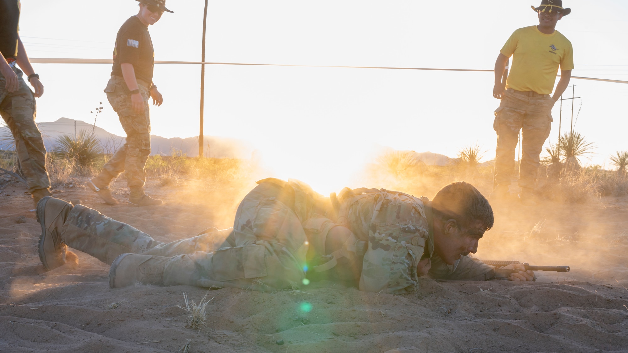 U.S. Space Force 1st Lt. Jordan Savage, Los Angeles Air Force Base space systems command project manager, low crawls through the sand during a Spur Ride at Fort Bliss, Texas, April 29, 2024.