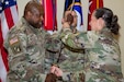 Lt. Gen. Jody Daniels, chief of Army Reserve and commanding general, U.S. Army Reserve Command, exchanges the command saber with Chief Warrant Officer 5 LaShon White during an assumption of responsibility ceremony at Fort Liberty, North Carolina, on May 3, 2024. White became the first Black command chief warrant officer in the history of the U.S. Army Reserve Command. (U.S. Army Photo by Sgt. Natalie Pantalos)