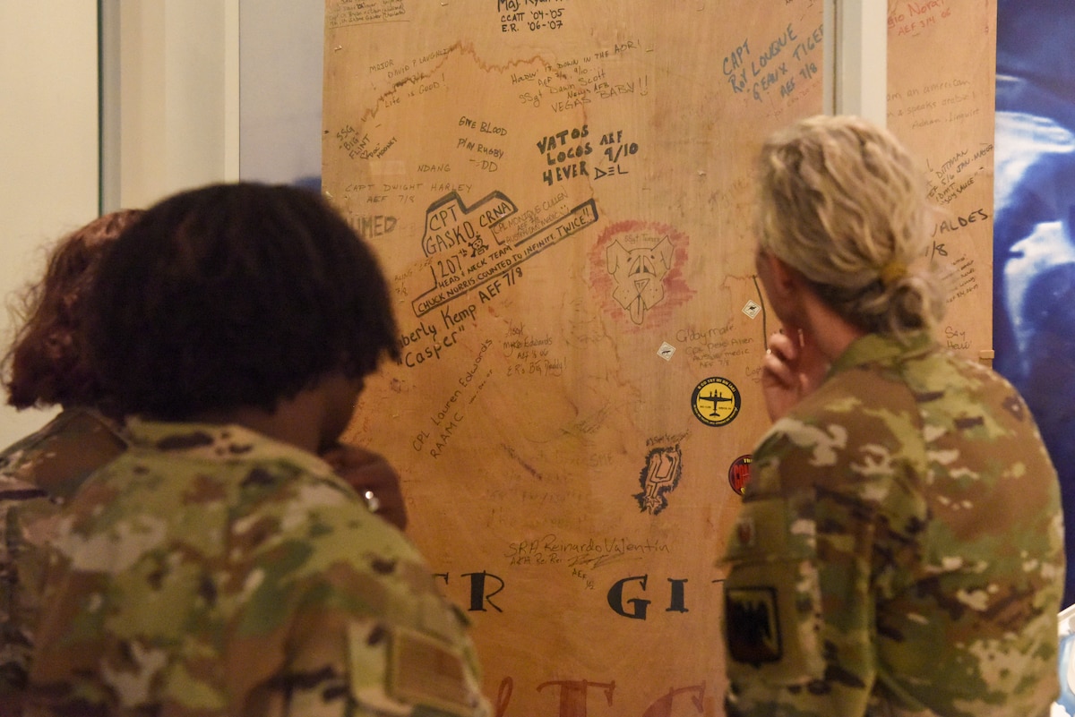 Image of Airmen looking at a display.