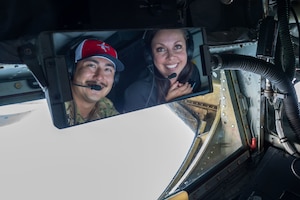 U.S. Air Force Senior Airman Nathan Zelasko, a boom operator assigned to the 91st Air Refueling Squadron, poses for a photo with Kelly Flannery, president of the South Tampa Chamber of Commerce, prior to a refueling mission over the Southeastern United States, April 11, 2024. Flannery was part of a civic leader group who toured various Air Force bases to strengthen relations and bolster community support. (U.S. Air Force photo by Airman 1st Class Sterling Sutton)