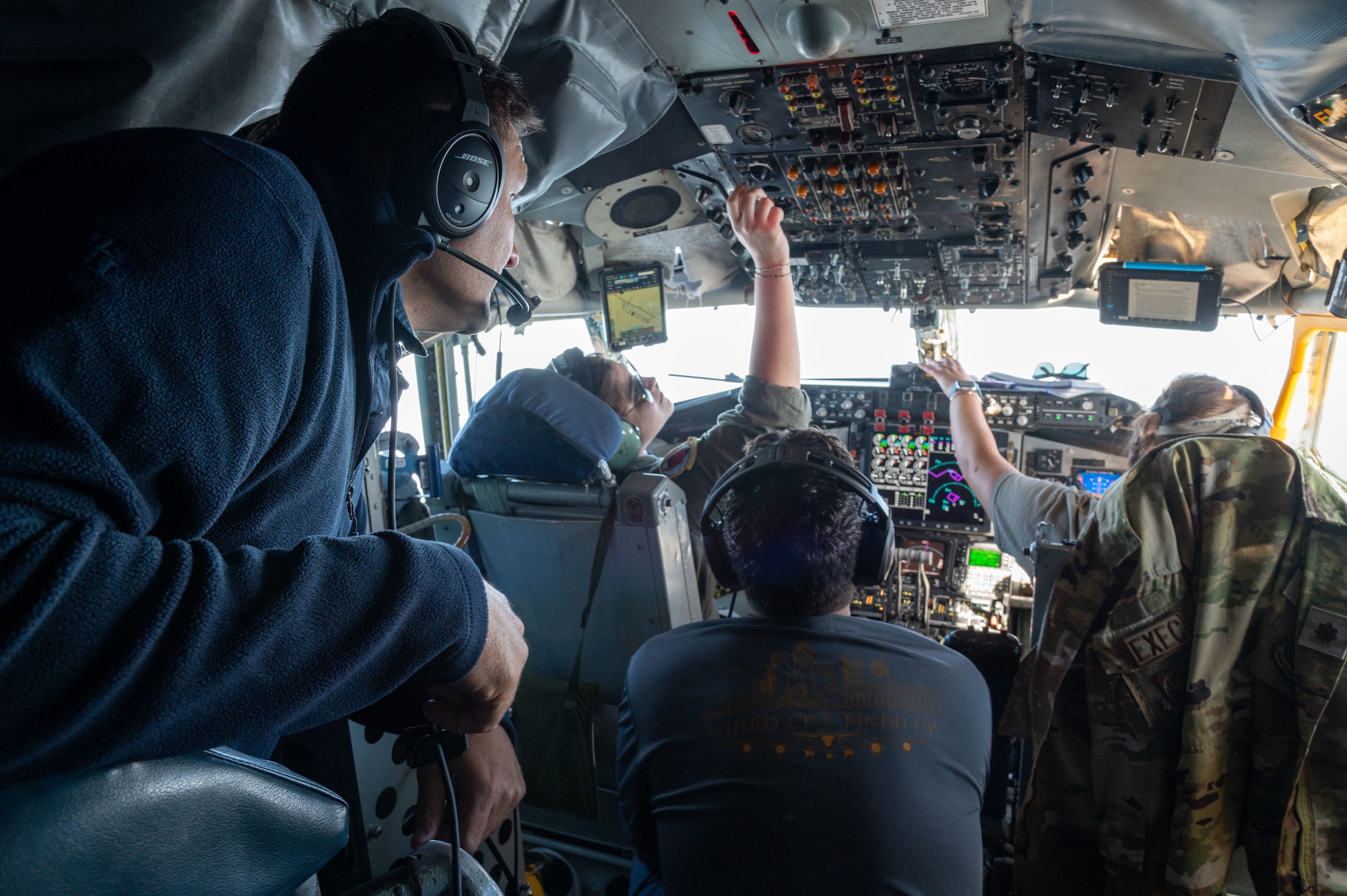 A pilot assigned to the 50th Air Refueling Squadron, explains flight procedures to civic leaders from the Tampa Bay area during a tour at MacDill Air Force Base, Florida, April 11, 2024. The civic leader group toured multiple bases to strengthen relations and bolster community support. (U.S. Air Force photo by Airman 1st Class Sterling Sutton)
