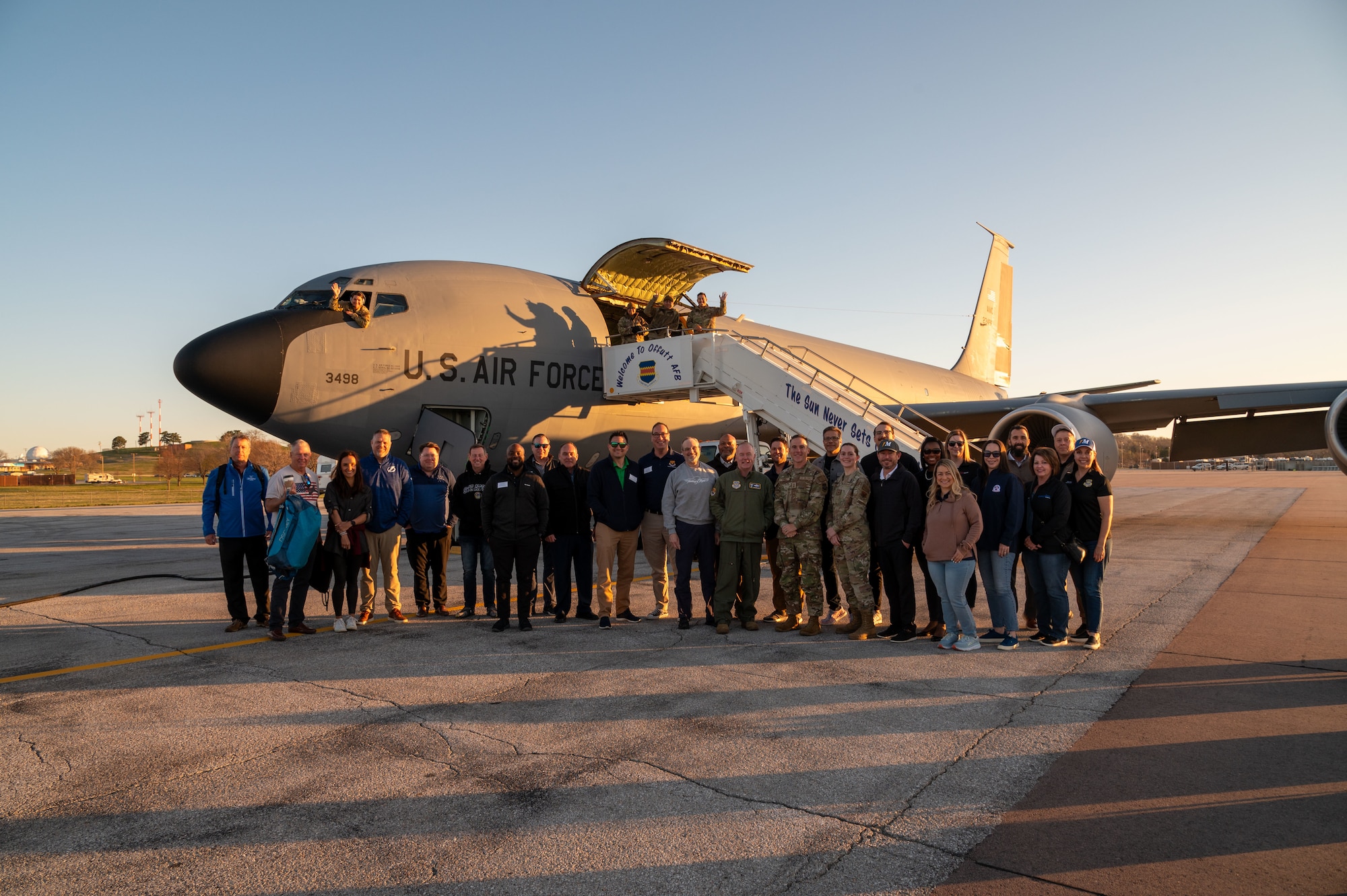 A group of civic leaders from the Tampa Bay area pose with service members assigned to the 55th Wing and the 6th Air Refueling Wing, for a photo near a KC-135 Stratotanker at Offutt Air Force Base, Nebraska, April 11, 2024. The civic leader group toured various units at the Nebraska base during multi-base field trip to strengthen relations and bolster community support. (U.S. Air Force photo by Airman 1st Class Sterling Sutton)