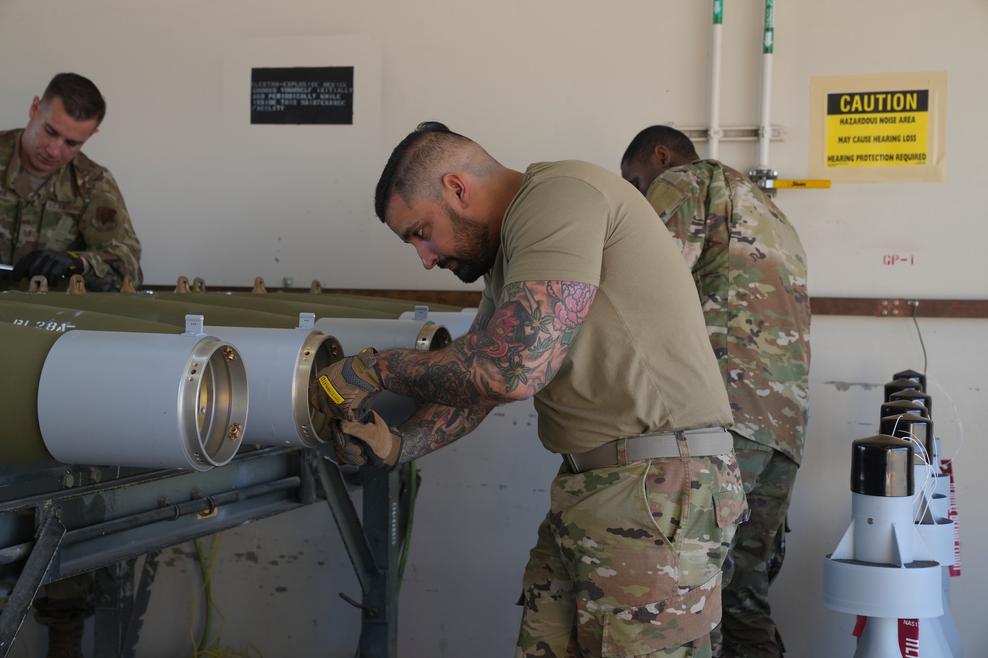 An airman building a guided bomb unit.