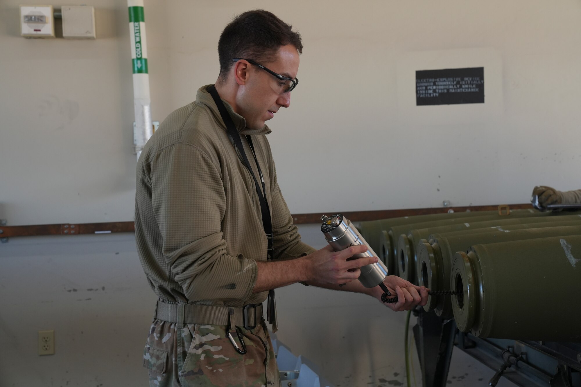 An airman building a bomb.