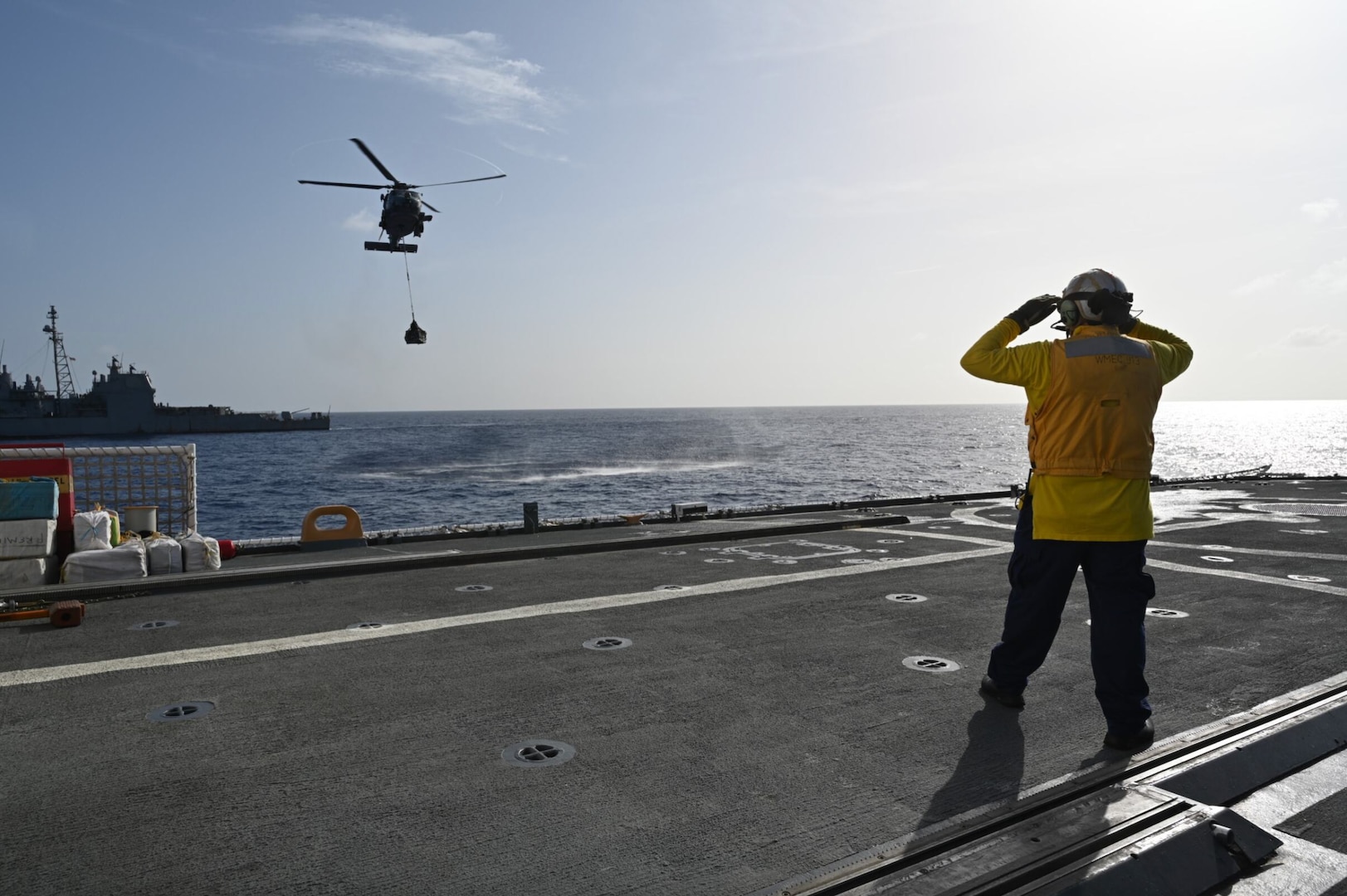 A Helicopter Maritime Strike Squadron (HSM) 50 aircrew deployed aboard the USS Leyte Gulf (CG 55) hovers over the U.S. Coast Guard Cutter Mohawk (WMEC 913) in the Atlantic Ocean, April 24, 2024. The crew of U.S. Coast Guard Cutter Mohawk (WMEC 913) offloaded more than 13,803 pounds of cocaine and 3,736 pounds of marijuana with a combined estimated street value of approximately $185 million in Port Everglades on May 10, 2024. (U.S. Coast Guard courtesy photo)