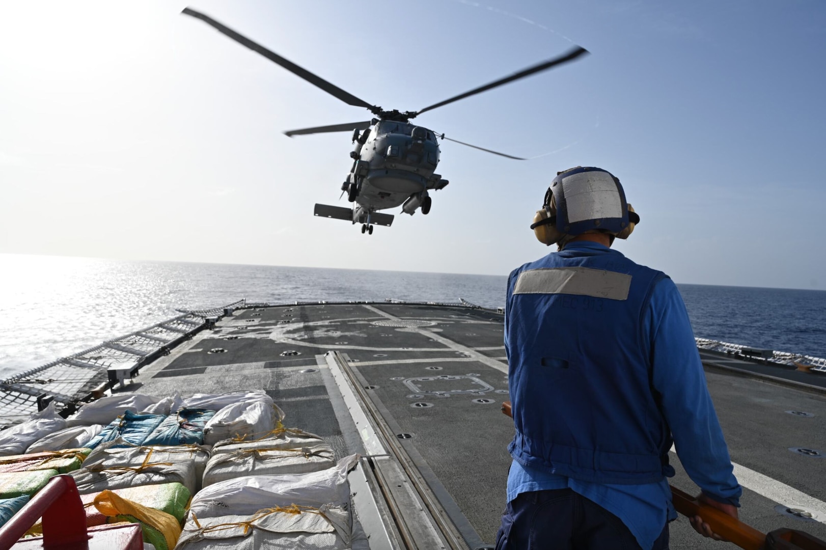 A Helicopter Maritime Strike Squadron (HSM) 50 aircrew deployed aboard the USS Leyte Gulf (CG 55) hovers over the U.S. Coast Guard Cutter Mohawk (WMEC 913) in the Atlantic Ocean, April 24, 2024. The crew of U.S. Coast Guard Cutter Mohawk (WMEC 913) offloaded more than 13,803 pounds of cocaine and 3,736 pounds of marijuana with a combined estimated street value of approximately $185 million in Port Everglades on May 10, 2024. (U.S. Coast Guard courtesy photo)