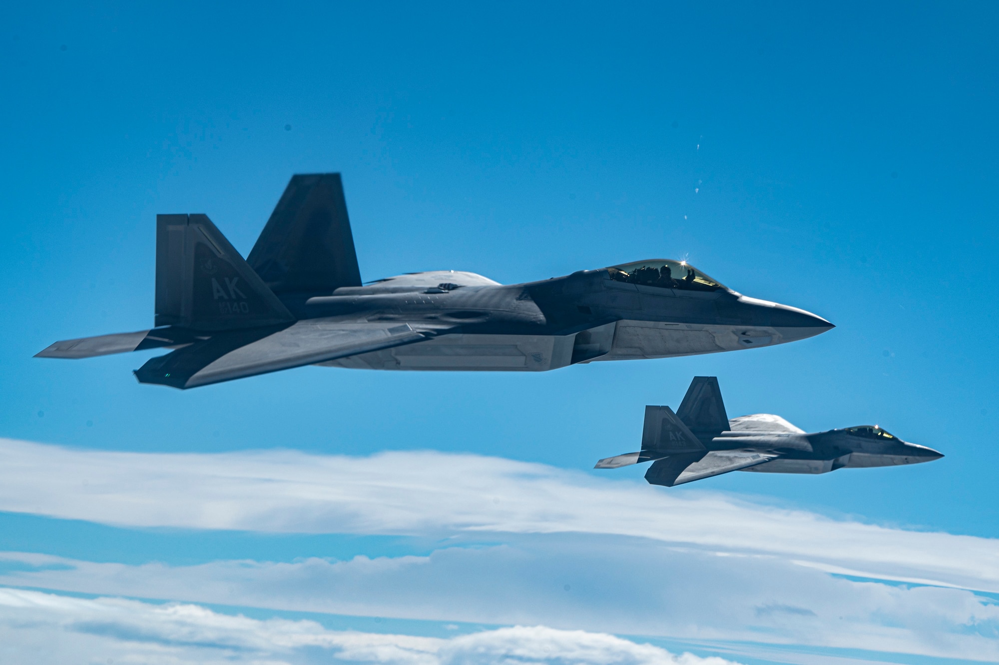 Two fighter jets fly in the sky