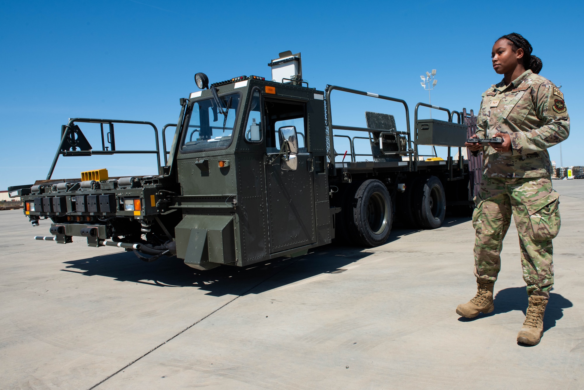 Airman operates loader remotely