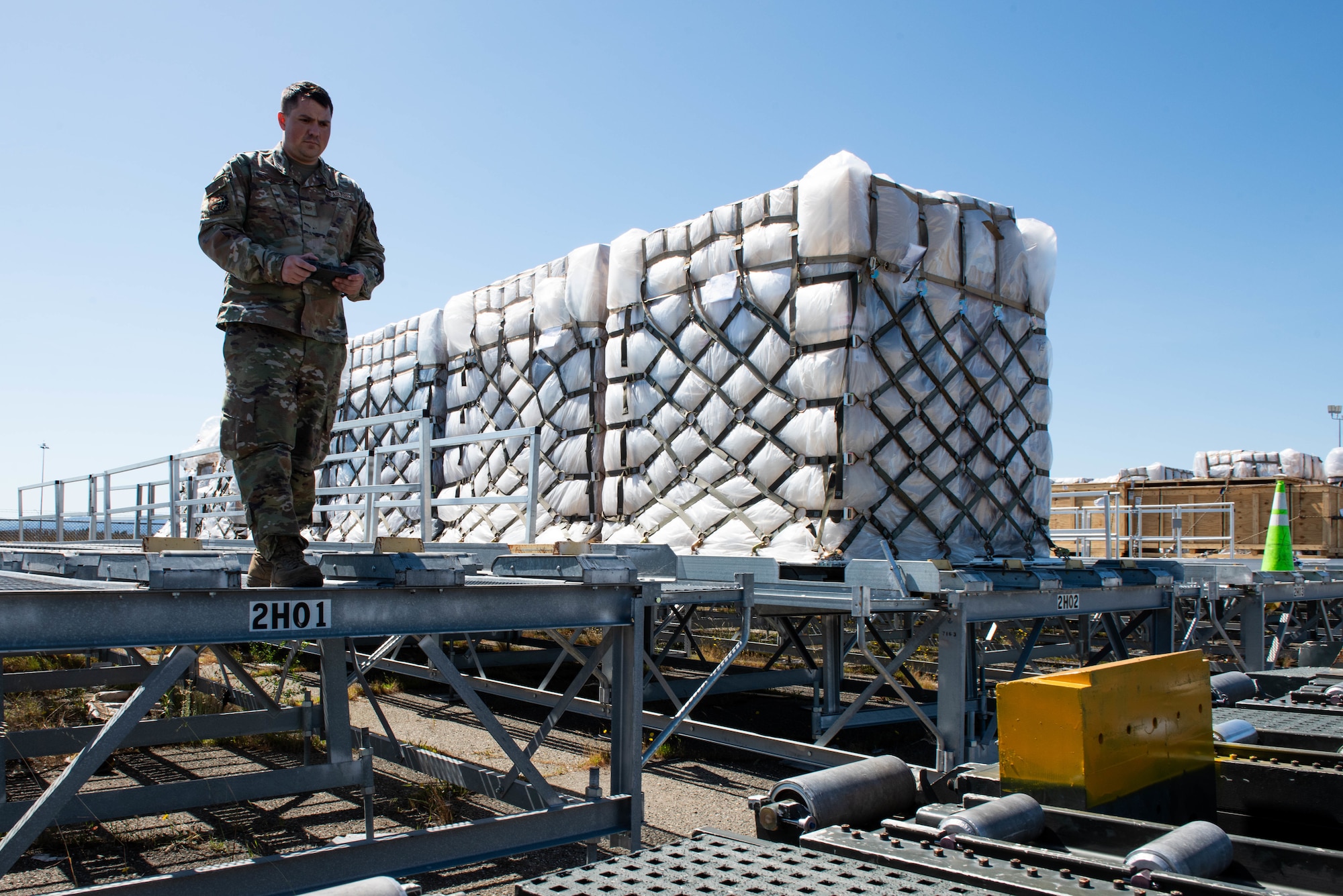 Airman operates loader remotely