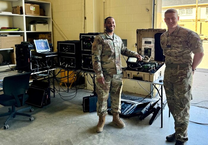 O'Rourke looks at the camera with Air Force member to left of him in the LOGDET facility