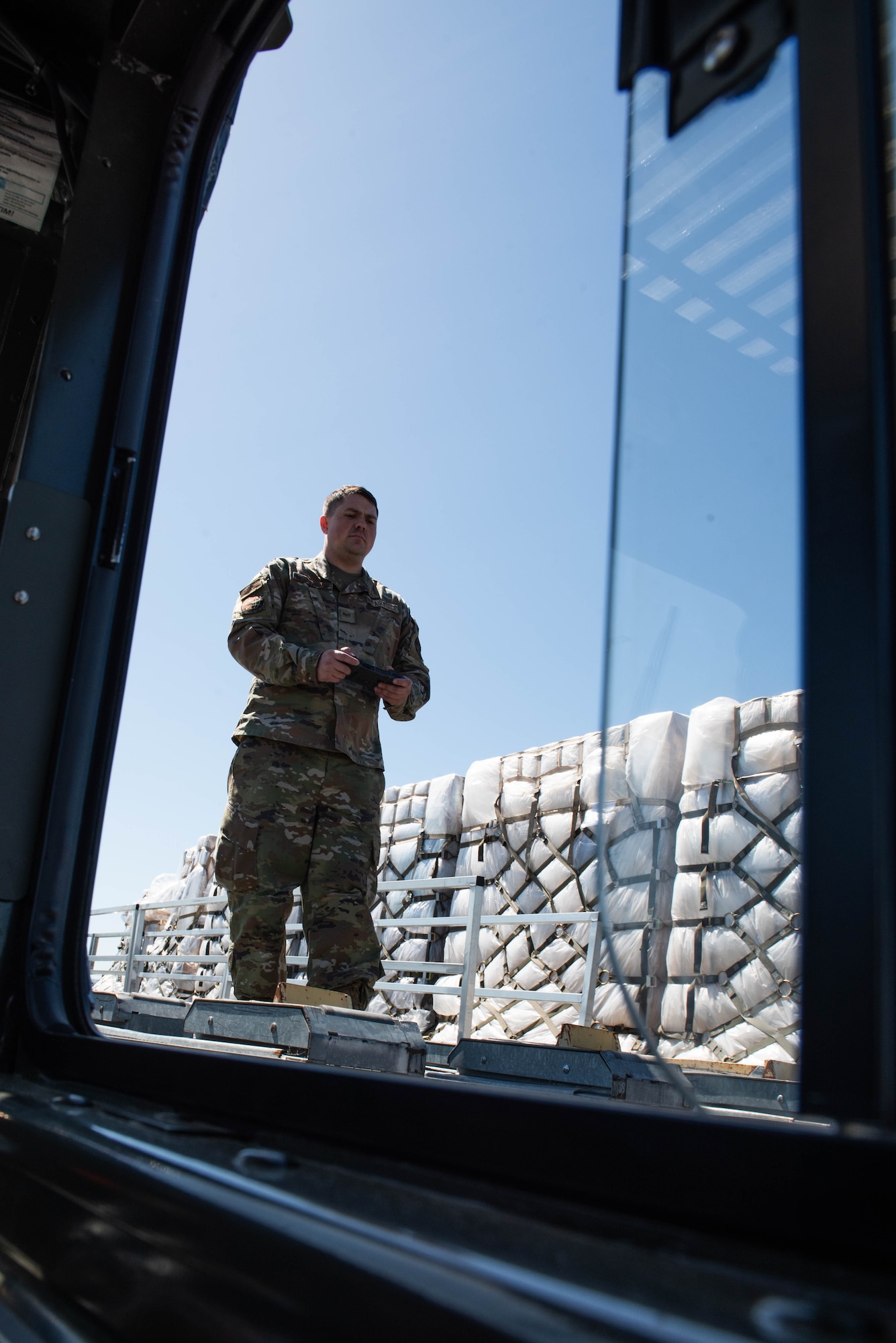 Airman operates loader remotely