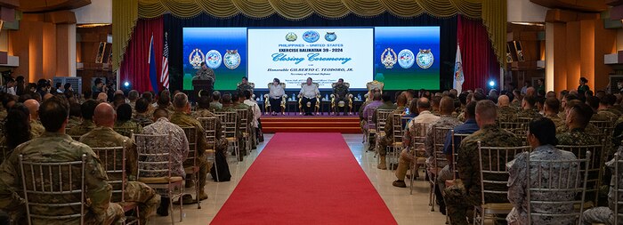 240510-F-YT646-1568 CAMP AGUINALDO, Philippines (May 10, 2024) U.S. Marine Corps Lt. Gen Michael S. Cederholm, U.S. Exercise Director representative and I Marine Expeditionary Force Commanding General, gives remarks during a closing ceremony for Exercise Balikatan 24 at Camp Aguinaldo, Manila, Philippines, May 10, 2024. BK 24 is an annual exercise between the Armed Forces of the Philippines and the U.S. military designed to strengthen bilateral interoperability, capabilities, trust, and cooperation built over decades of shared experiences. (U.S. Air Force photo by Staff Sgt. Pedro Tenorio)