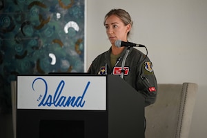 A photo of an Airman speaking.