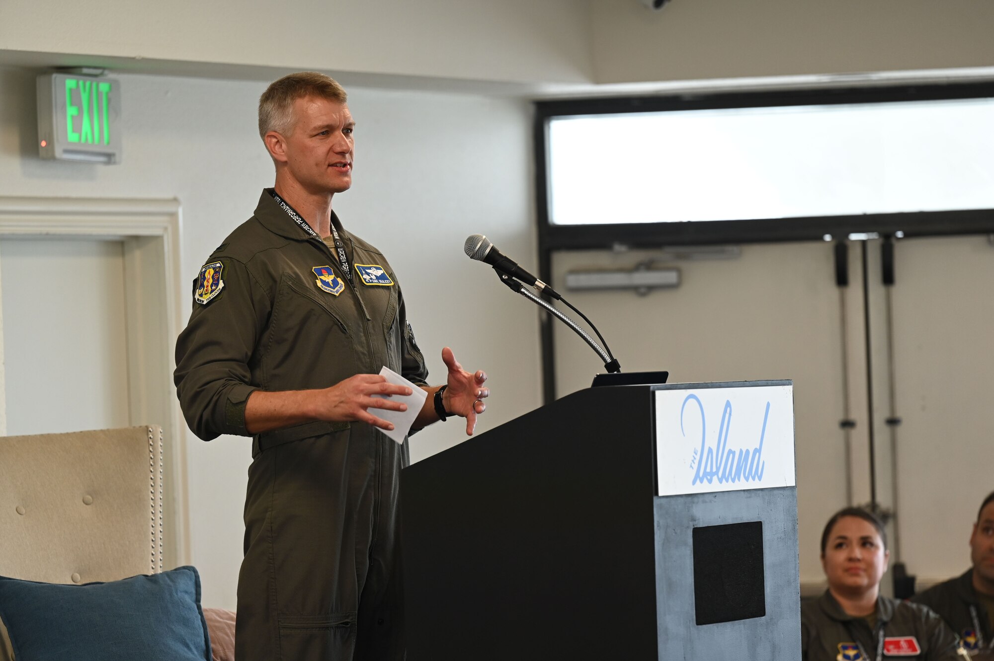 A photo of an Airman speaking.