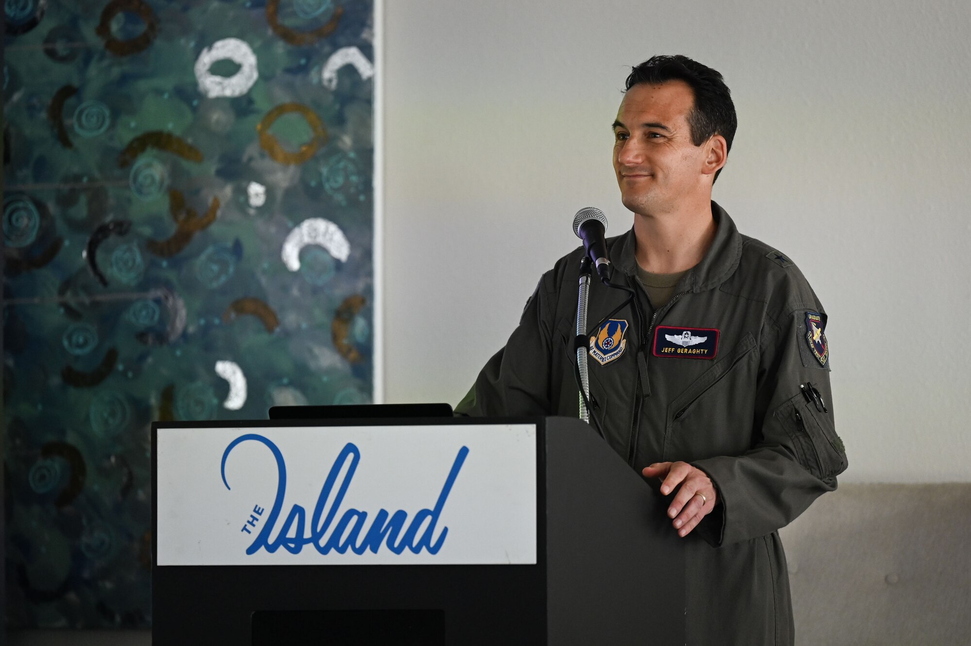 A photo of an Airman speaking.