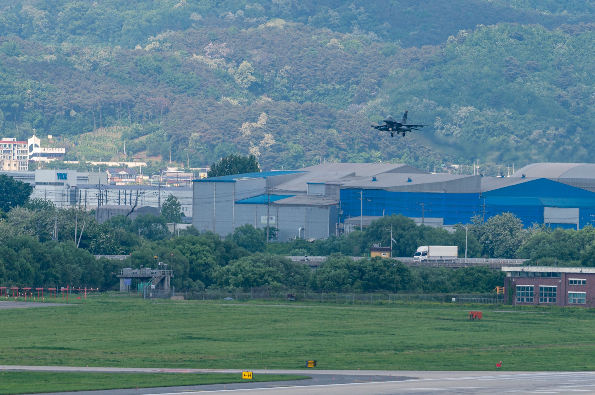 A U.S. Air Force F-16 Fighting Falcon assigned to the 36th Fighter Squadron prepares to land on a runway at Osan Air Base, Republic of Korea, May 8, 2024. Fourteen aircraft returned to Osan AB from Red Flag-Alaska 24-1. RF-A is a Pacific Air Forces-led training that is designed to enhance air operations, improve interoperability and strengthen alliances and partnerships. (U.S. Air Force Photo by Senior Airman Kaitlin Frazier)