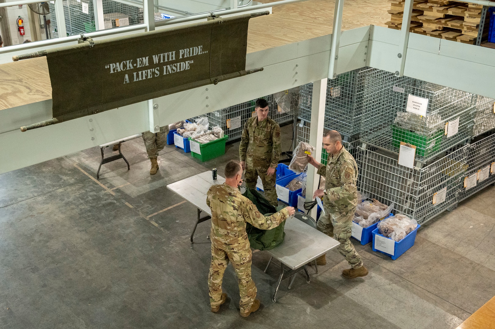 a man is handed a bag in a warehouse