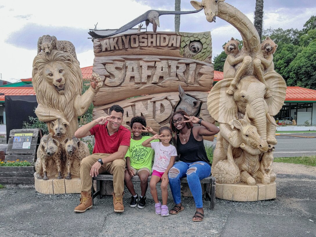 Catherine Matchem-Watkins, a Marine Corps Family Team Building Trainer with Marine Corps Community Services Iwakuni, poses for a photo with her family at Akiyoshidai Safari Land, Japan. Matchem-Watkins, a native of Chicago, Illinois, learned time management skills at a young age that she continues to use to this day to effectively balance time with her family, work, and volunteering in her busy schedule. (U.S. Marine Corps Photo by Lance Cpl. Dahkareo Pritchett)