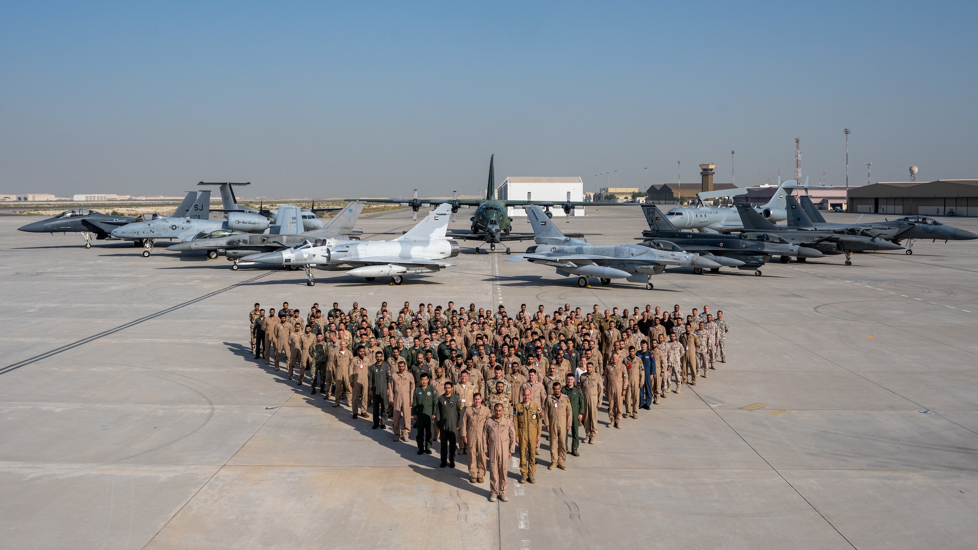 Aircrew from 10 different countries along with 12 airframes pose for a group photo after they participate in Desert Flag 2024, located within the U.S. Central Command area of responsibility, hosted by the United Arab Emirates, April 21 to May 10, 2024. Desert Flag is a Red Flag-style exercise and is intended to build upon a cohesive fighting force in the defense of the Arabian Peninsula. Along with the U.S., the participating countries include: France, Germany, Kuwait, Oman, Saudi Arabia, South Korea, Turkey, UAE, and the United Kingdom. (U.S. Air Force Photo)