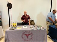 Army Soldier in official Army Medicine polo stands at Army Medicine booth