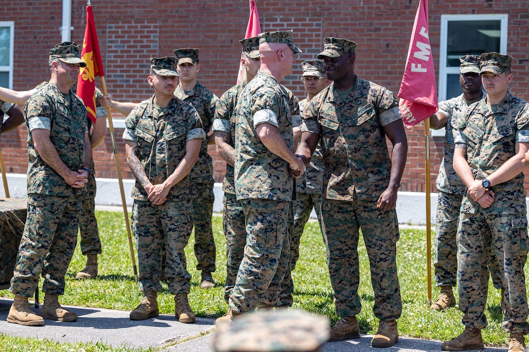 U.S. Marine Corps Sgt. Gregory McCall, a mortarman with Battalion Landing Team 1/6, 26th Marine Expeditionary Unit (Special Operations Capable) is recognized by Lt. Gen. David A. Ottignon alongside other Marines during an award ceremony for the II MEF “Lt. Gen. Chesty Puller” Outstanding Leadership Award, Camp Lejeune, Marine Corps Base Camp Lejeune, May 7, 2024. The II MEF Lieutenant General “Chesty” Puller Award is awarded to units within the II MEF that showed outstanding ability and superior performance in supporting the mission of the II MEF within the past year. (U.S. Marine Corps photo by Cpl. Rafael Brambila-Pelayo)