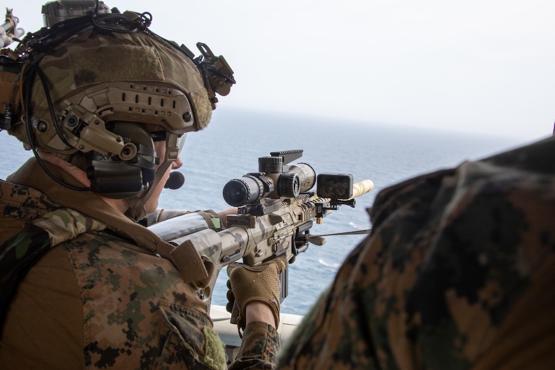 U.S. Marines with the Maritime Special Purpose Force, 24th Marine Expeditionary Unit (MEU) provide sniper fire support for a MV-22B Osprey with Marine Medium Tiltrotor Squadron 365 (Reinforced), 24th MEU landing aboard the Harpers Ferry-class dock landing ship USS Oak Hill (LSD 51) during a simulated visit, board, search, and seizure as part of Composite Training Unit Exercise (COMPTUEX) in the Atlantic Ocean, May, 9 2024. The Wasp (WSP) Amphibious Ready Group (ARG)-24th MEU is conducting COMPTUEX, their final at-sea, certification exercise under the evaluation of Carrier Strike Group 4 and Expeditionary Operations Training Group. Throughout COMPTUEX, the WSP ARG-24th MEU is evaluated across a spectrum of scenarios that determine their readiness to deploy. (U.S. Marine Corps Photo by Cpl. Elton Taylor)