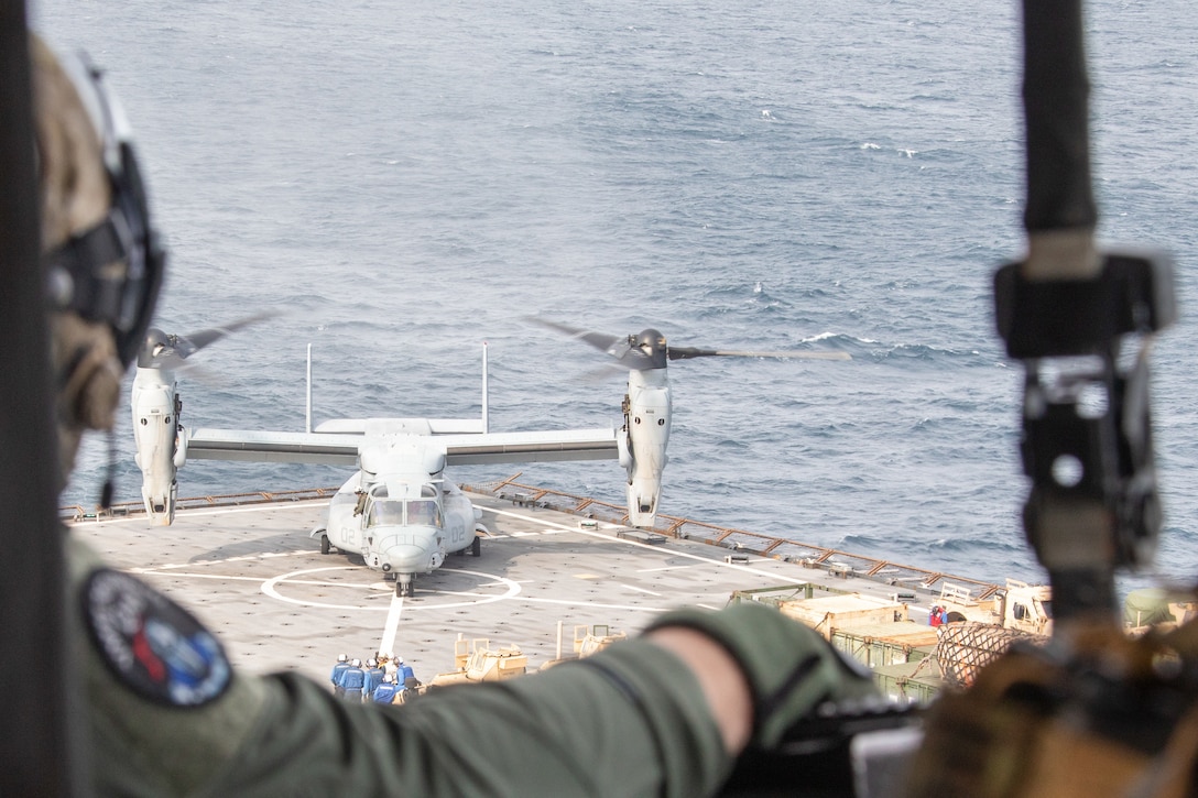 U.S. Marines with the Maritime Special Purpose Force, 24th Marine Expeditionary Unit (MEU) provide sniper fire support for a MV-22B Osprey with Marine Medium Tiltrotor Squadron 365 (Reinforced), 24th MEU landing aboard the Harpers Ferry-class dock landing ship USS Oak Hill (LSD 51) during a simulated visit, board, search, and seizure as part of Composite Training Unit Exercise (COMPTUEX) in the Atlantic Ocean, May, 9 2024. The Wasp (WSP) Amphibious Ready Group (ARG)-24th MEU is conducting COMPTUEX, their final at-sea, certification exercise under the evaluation of Carrier Strike Group 4 and Expeditionary Operations Training Group. Throughout COMPTUEX, the WSP ARG-24th MEU is evaluated across a spectrum of scenarios that determine their readiness to deploy. (U.S. Marine Corps Photo by Cpl. Elton Taylor)