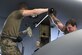 Master Sgt. Chad Conroy and Tech. Sgt. Dakota Perkins, aircraft fuel system craftsmen assigned to the 910th Maintenance Squadron, use a breaker bar to loosen the bolts that affix a fuel tank to the wing of a C-130H Hercules aircraft at Youngstown Air Reserve Station, Ohio, May 7, 2024. The maintainers removed the aircraft’s fuel tanks, a rarely performed operation, to store them for potential future use on the unit’s new C-130J-30 aircraft, slated to arrive at the installation this summer. (U.S. Air Force photo by Eric M. White)
