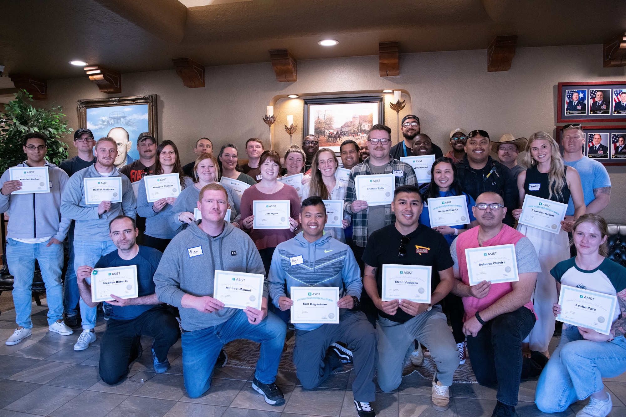 U.S. Air Force Airmen assigned to the 27th Special Operations Wing and civilians pose for a photograph after completing an Applied Suicide Intervention Skills Training (ASIST) workshop at Cannon Air Force Base, New Mexico, May 7, 2024. The ASIST workshops are supported by over 40 years of research and evidence, and have been shown to increase participants’ counseling and listening skills. (U.S. Air Force photo by Senior Airman Drew Cyburt)