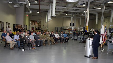 Attendees listen to speakers during a ribbon-cutting ceremony May 2 at Tobyhanna Army Depot, Pennsylvania, where the U.S. Army Medical Materiel Agency recently moved its Medical Maintenance Operations Division into a newly renovated building on the installation. (Photo Credit: C.J. Lovelace)