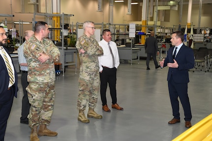 William Wall, right, interim director of the U.S. Army Medical Materiel Agency’s Medical Maintenance Operations Division at Tobyhanna Army Depot, leads a tour of MMOD-PA’s newly modernized space following a May 2 ribbon-cutting ceremony at the Pennsylvania installation. (Photo Credit: C.J. Lovelace)