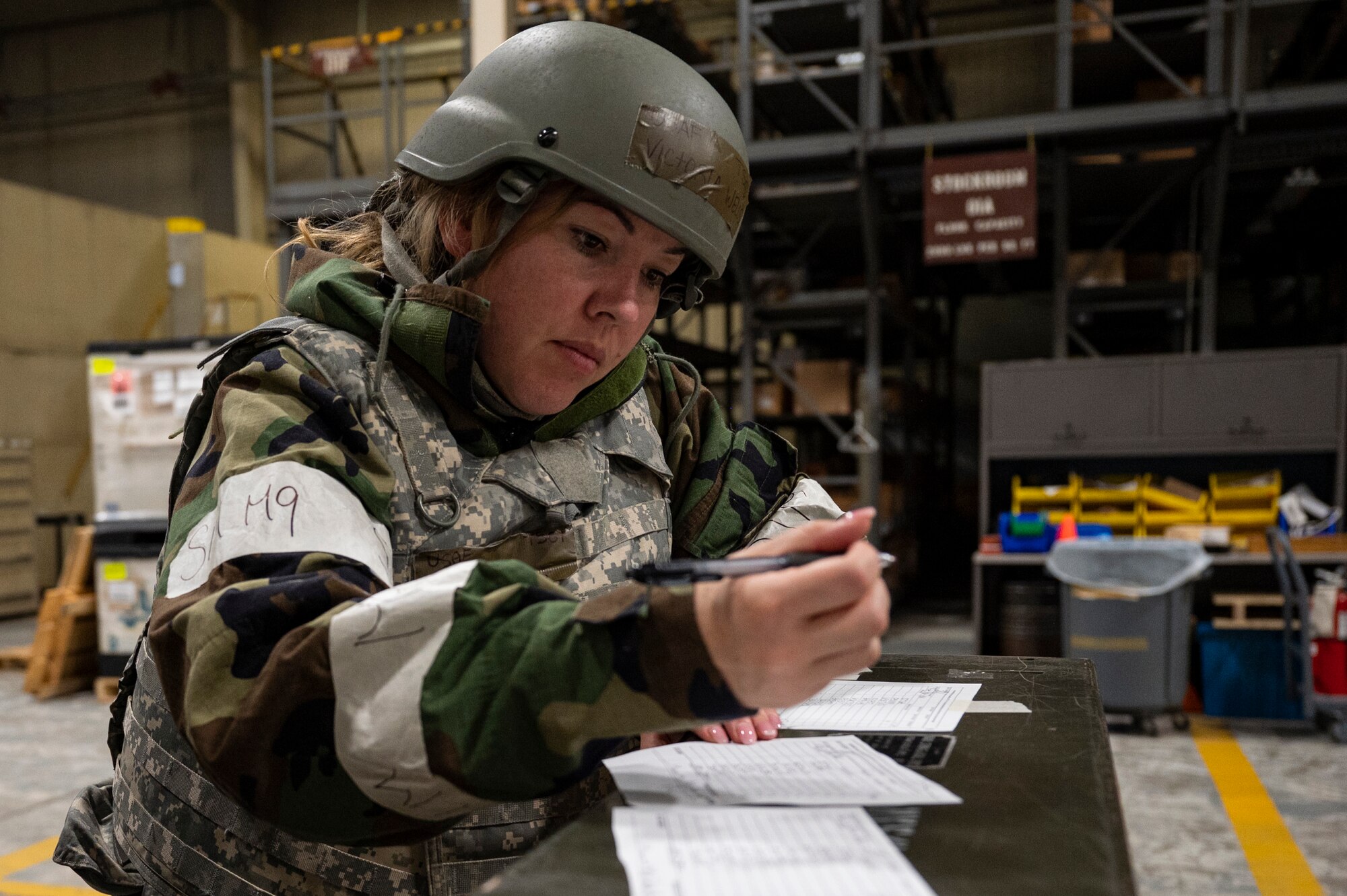 U.S. Air Force Tech. Sgt. Victoria Wells, 51st Force Support Squadron postal service center non-commissioned officer in charge, takes inventory of weapons during Beverly Herd 24-1 at Osan Air Base, Republic of Korea, May 13, 2024. Routine training like Beverly Herd are pivotal platforms for 51st Fighter Wing Airmen to refine their warfighting proficiencies through application, concurrently enhancing their ability to respond skillfully to contingencies. (U.S. Air Force photo by Senior Airman Kaitlin Frazier)