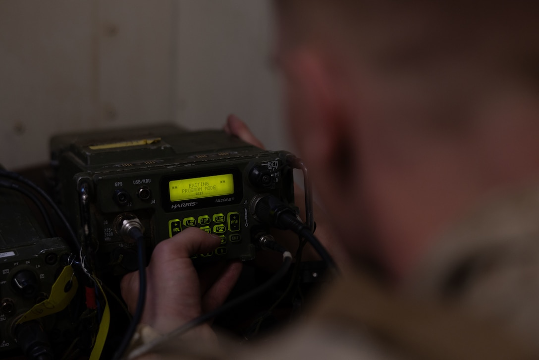 U.S. Marine Corps 2nd Lt. John Wholley, a Beverley, Massachusetts native, student with Marine Corps Communication-Electronics School, Training and Education Command, changes radio frequencies of a radio during Basic Communications Officer Course 1-24 at Range 800, Marine Corps Air-Ground Combat Center, Twentynine Palms, California, April 30, 2024. During the BCOC students learn about signal modulation, basic electrical concepts and how to build field expedient antennas. (U.S. Marine Corps photo by Lance Cpl. Anna Higman) (U.S. Marine Corps photo by Lance Cpl. Anna Higman)