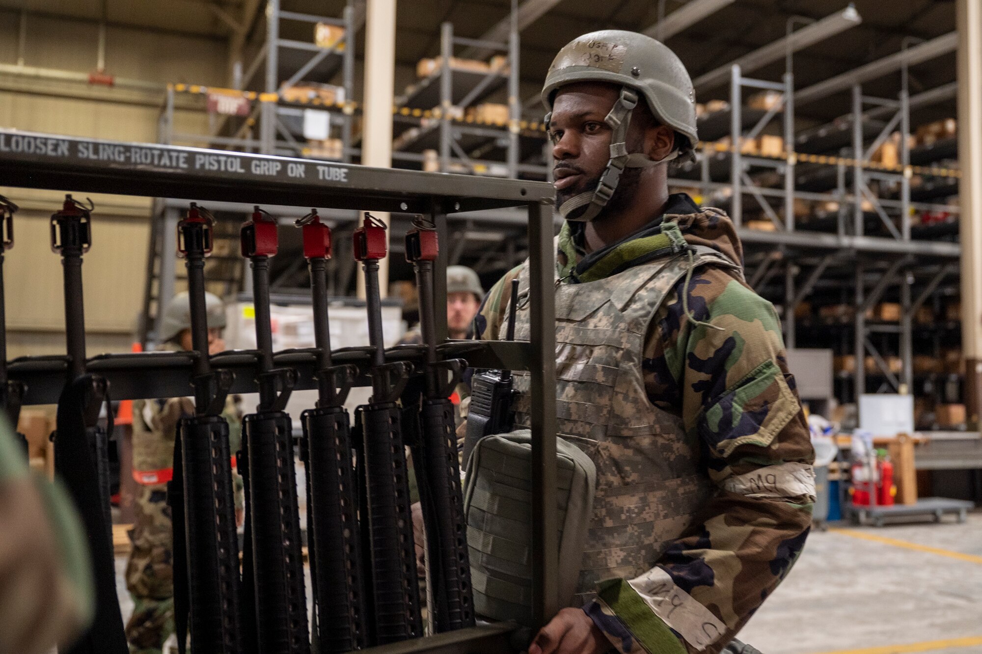 U.S.Air Force Airman 1st Class Davion Clark, 51st Force Support Squadron postal clerk, loads weapons during Beverly Herd 24-1 at Osan Air Base, Republic of Korea, May 13, 2024. During the training, base personnel demonstrated their ability to navigate various attack scenarios while  launching and recovering aircraft during 24-hour flying operations, validating the 51st Fighter Wing’s readiness and response against any adversary. The 51st FW guards the freedom of 51 million people by deterring aggression, defending the ROK, and defeating any attack against the ironclad ROK-US Alliance. (U.S. Air Force photo by Senior Airman Kaitlin Frazier)