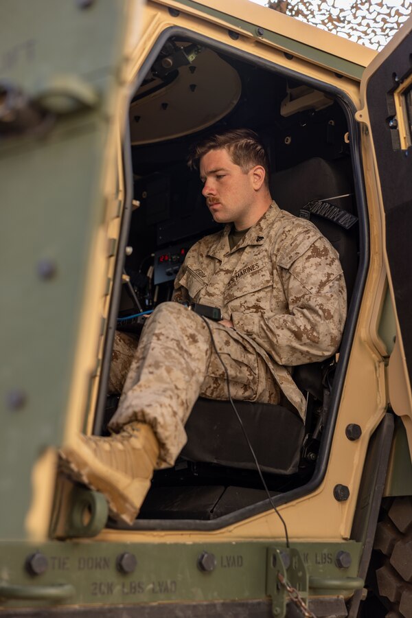 U.S. Marine Corps Cpl. Nicholas Verda, a Normal, Illinois native, network administrator with Headquarters Battalion, 12th Marine Littoral Regiment, 3rd Marine Division, prepares for a culminating event during Expeditionary Communications Course 1-24 hosted by Marine Corps Communication-Electronics School at Marine Corps Air-Ground Combat Center, Twentynine Palms, California, May 2, 2024. ECC trains Marines in expeditionary skillsets that enable them to operate independently and to assemble various types of communication equipment in any environment across the full range of military operations. (U.S. Marine Corps photo by Lance Cpl. Anna Higman)