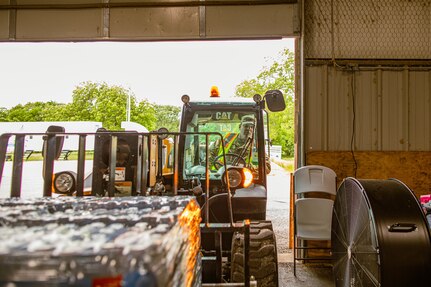 Sgt. Andrew Serna, a Dallas, Texas, resident serving with Delta Company, 700th Brigade Support Battalion, 45th Infantry Brigade Combat Team, Oklahoma Army National Guard, operates a forklift during tornado recovery efforts at the Murray County Expo Center in Sulphur, Oklahoma, May 9, 2024.