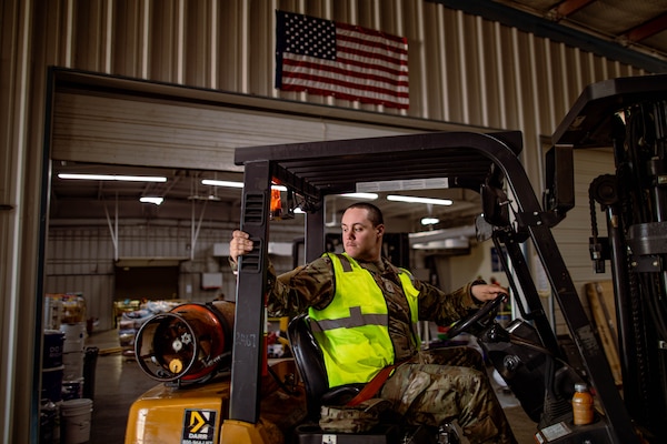 Pfc. Michael Wade, a Tulsa, Oklahoma resident serving as a cavalry scout in Alpha Troop, 1st Squadron, 180th Cavalry Regiment, 45th Infantry Brigade Combat Team, operates a forklift during tornado recovery efforts at the Murray County Expo Center in Sulphur, Oklahoma, May 9, 2024. Winters is one of the Oklahoma National Guard members activated to assist in warehouse operations supporting the emergency relief effort after an EF3 tornado devastated Sulphur on April 27. (Oklahoma National Guard photo by Sgt. Haden Tolbert)
