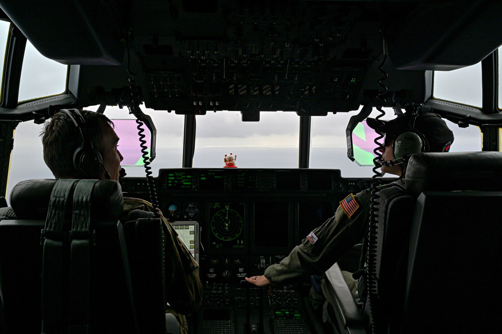 Lt. Col. William Dunn and Capt. Brittany Huggins, 130th Rescue Squadron HC-130J Combat King II pilots, perform overwatch for a search and rescue mission on the Royal Caribbean cruise line ship Ovation of the Seas 400 miles off the coast of San Francisco, California, May 7, 2024. This mission marked the 129th RQW's 1,161 life saved.