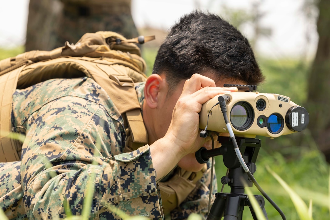 U.S. Marine Corps Cpl. Daniel Park, a fire support Marine with 5th Air Naval Gunfire Liaison Company, III Marine Expeditionary Force Information Group, performs simulated maritime surveillance during Katana Strike 24 at Iejima, Okinawa, Japan, May 8, 2024. Katana Strike 24 is an annual exercise designed to further strengthen 5th ANGLICO's ability to conduct long-range communications and dynamic targeting cycles between joint ground, naval and aviation units in support of multi-domain operations. Park is a native of Georgia. (U.S. Marine Corps photo by Cpl. Bridgette Rodriguez)