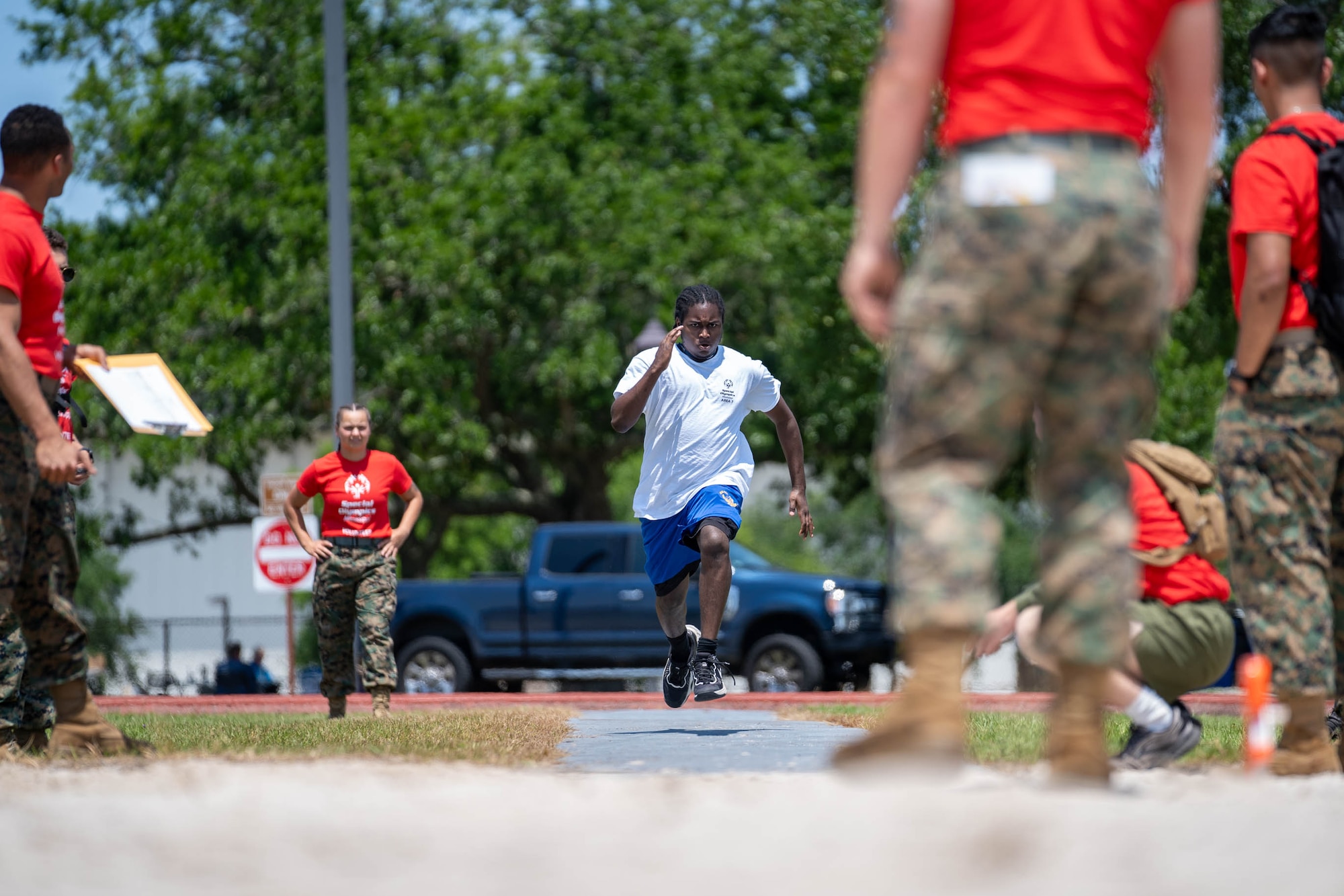 A Special Olympics Mississippi athlete takes a running start for a long jump competition at Keesler Air Force Base, Mississippi, May 11, 2024.