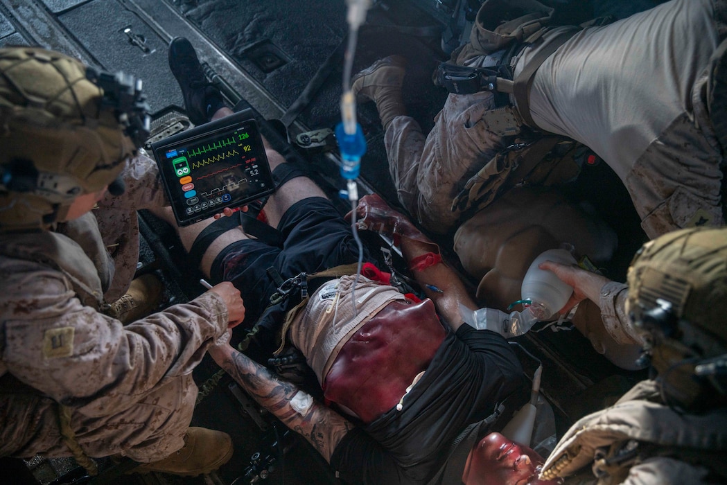 240409-M-PO838-1237 U.S. Sailors assigned to the 15th Marine Expeditionary Unit apply medical care to a simulated casualty aboard a CH-53E Super Stallion attached to Marine Medium Tiltrotor Squadron (VMM) 165 (Reinforced), 15th MEU, during en route care training in the South China Sea April 9, 2024. The amphibious transport dock USS Somerset (LPD 25) and embarked elements of the 15th MEU are conducting routine operations in the U.S. 7th Fleet area of operations. 7th Fleet Is the U.S. Navy’s largest forward-deployed numbered fleet, and routinely interacts and operates with allies and partners in preserving a free and open Indo-Pacific region. (U.S. Marine Corps photo by Sgt. Patrick Katz)