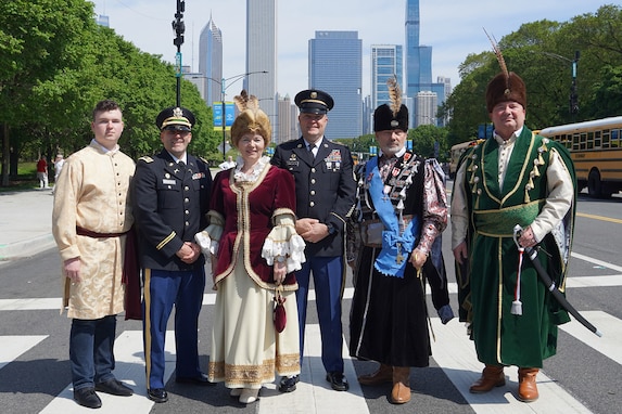 U.S. Army Reserve Capt. Matthew Wisniewski, second from left, and Master Sgt. Brad Tomasheski, fourth from left, 85th U.S. Army Reserve Support Command, participates in Chicago’s 133rd Polish Constitution Day Parade as honored guests, May 4, 2024.