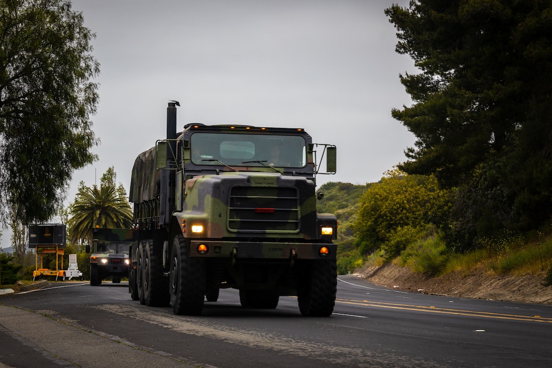 U.S. Marines with 9th Communication Battalion, I Marine Expeditionary Force Information Group, conduct a 35-mile convoy operation, also known as a battalion tactical road march, at Marine Corps Base Camp Pendleton, California, May 9, 2024. The convoy served as training for the battalion to enhance convoy operations, validate equipment readiness, and sustain the unit’s operational readiness. (Marine Corps photo by Cpl. Gabriela Garcia-Gregorio)