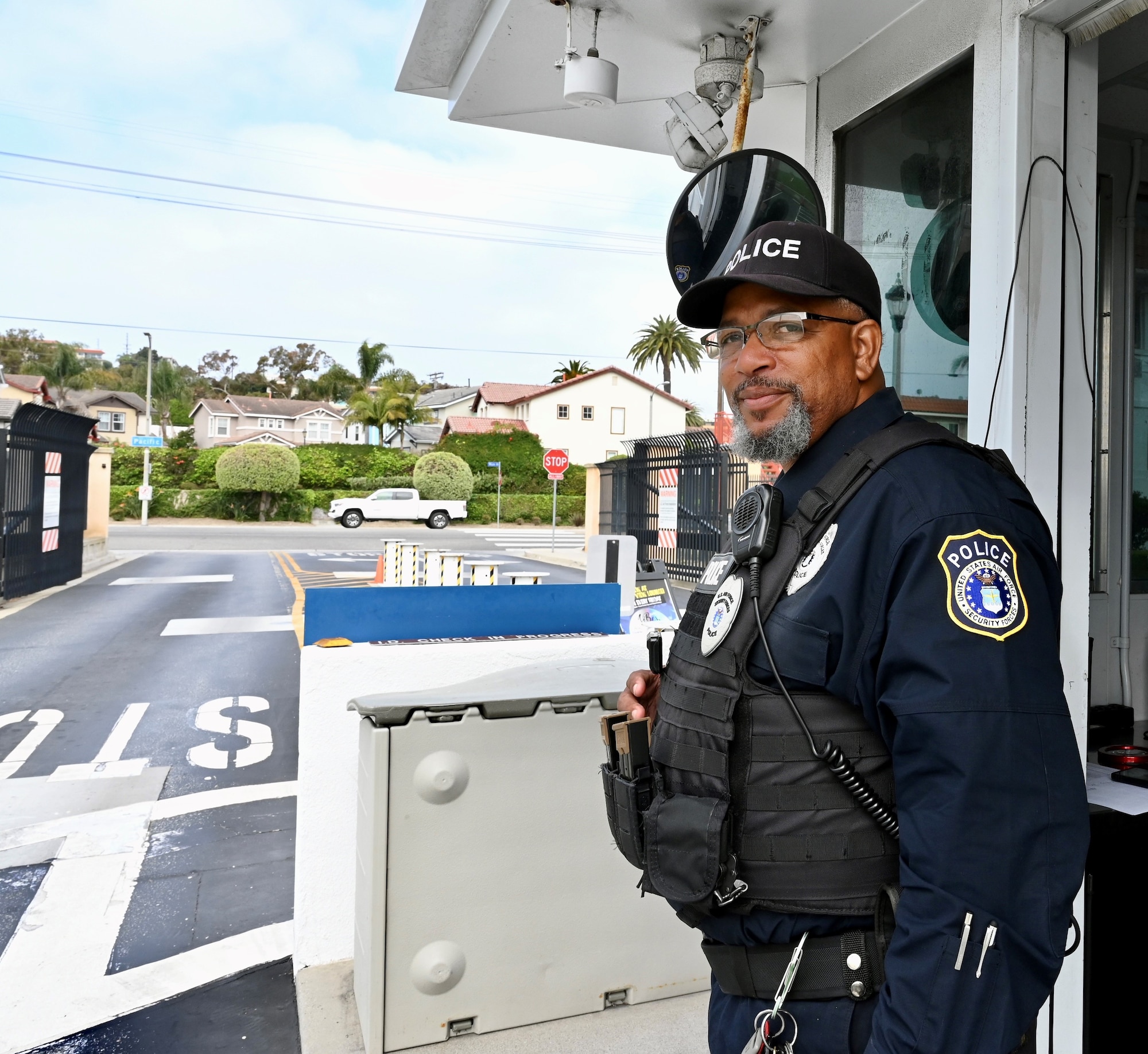 Officer Humphrey poses outside his guard shack at Fort MacArthur.