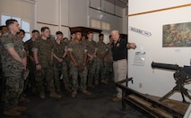 Len Howard, a docent with Marine Corps Recruit Depot San Diego Museum, gives a museum tour to U.S. Marines with Golf Company, 2nd Battalion, 1st Marine Regiment, during a visit at MCRD San Diego, California, April 29, 2024. The purpose of this visit was to familiarize the company with Special Duty Assignment opportunities as they weigh reenlistment options and career progression. (U.S. Marine Corps photo by Lance Cpl. Janell B. Alvarez)