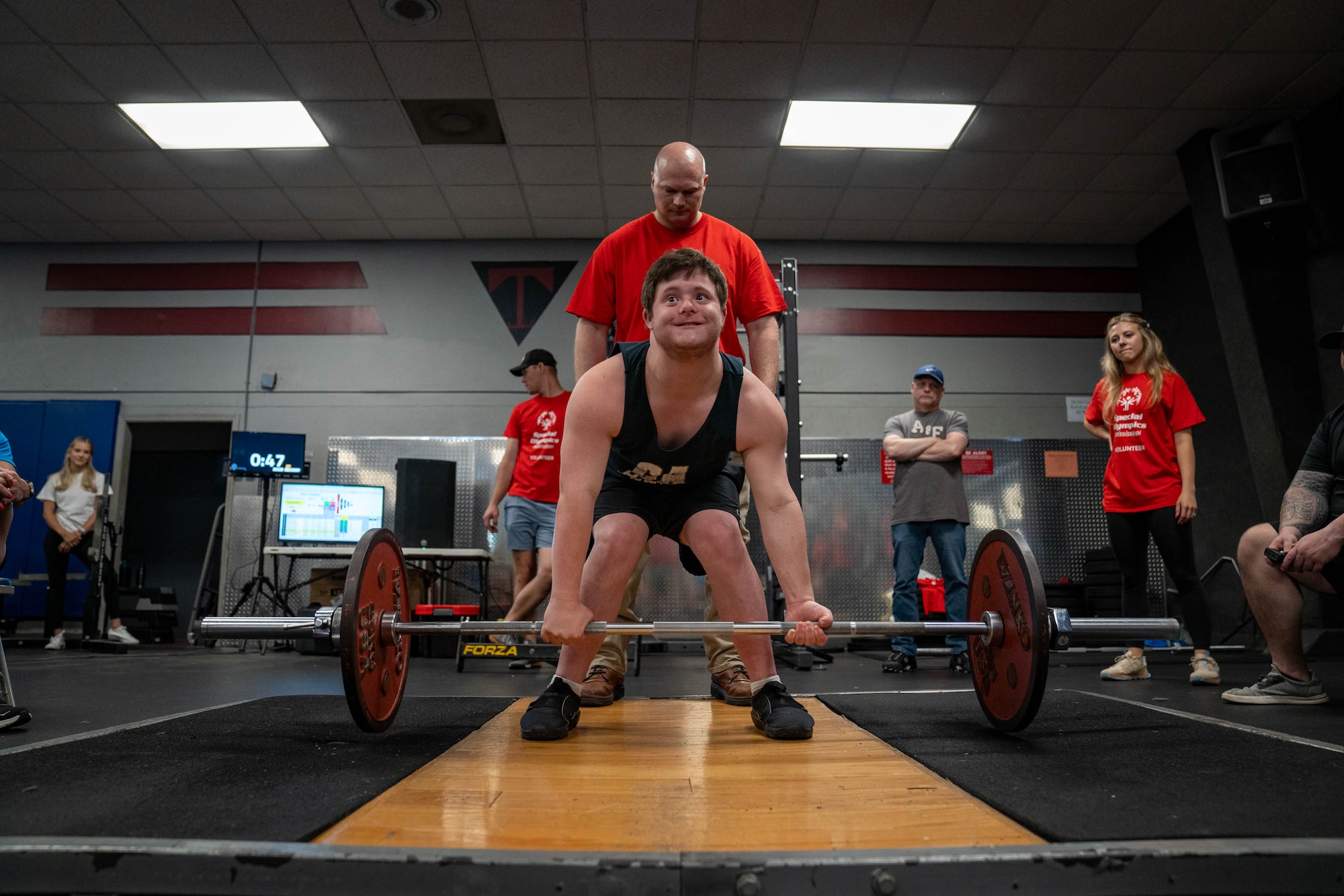A Special Olympics Mississippi athlete deadlifts during a weightlifting competition at Keesler Air Force Base, Mississippi, May 11, 2024.