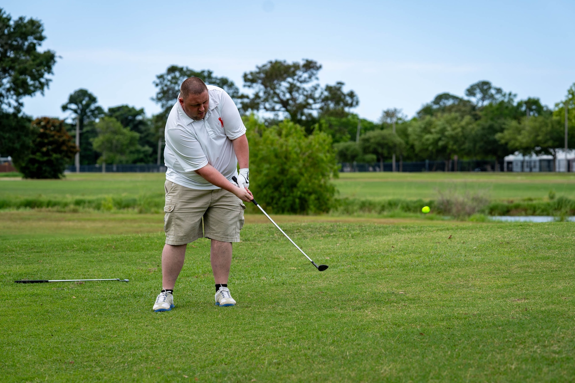 A Special Olympics Mississippi athlete competes in a golf tournament at Keesler Air Force Base, Mississippi, May 11, 2024.