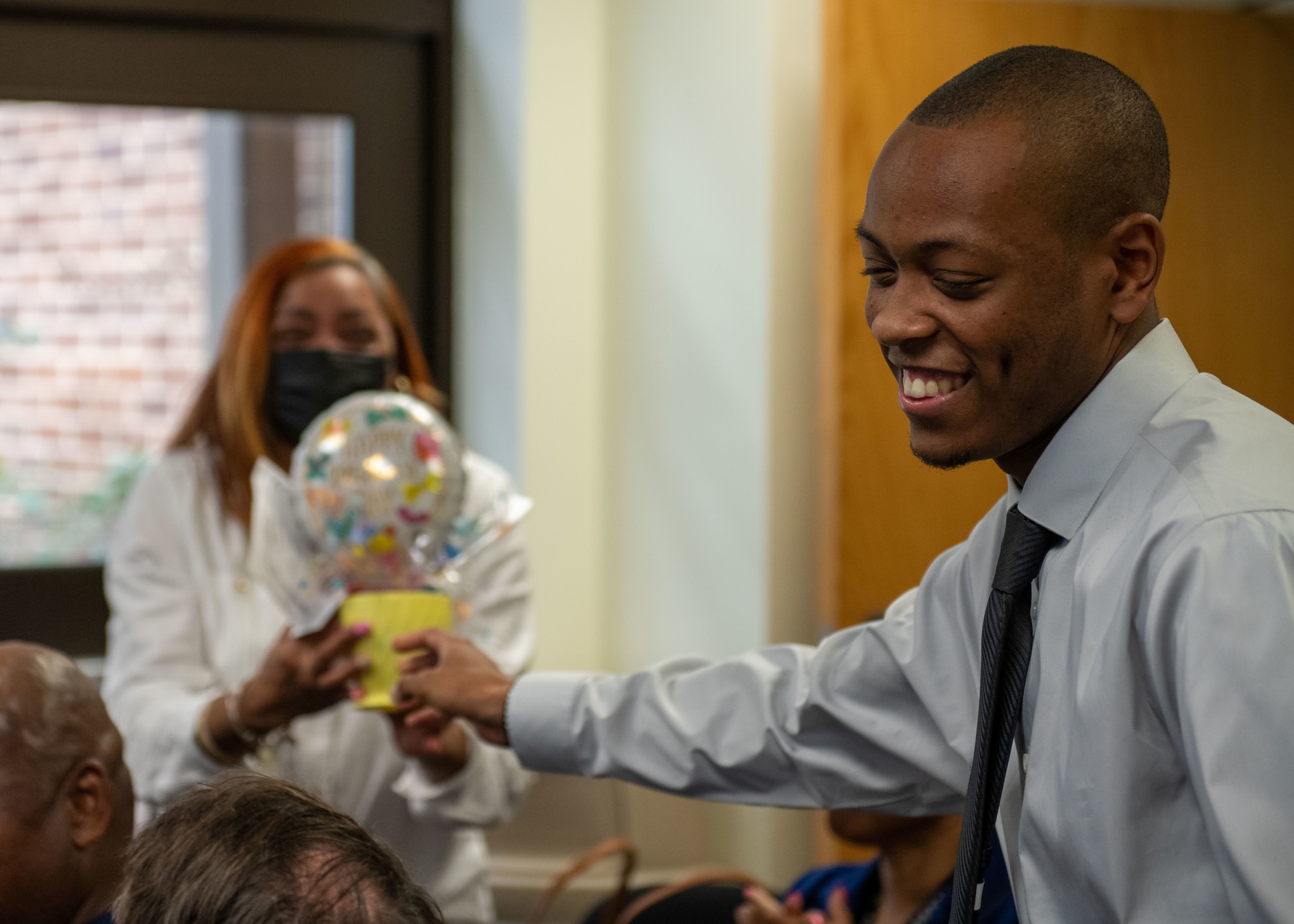 Graduate receives a gift basket.