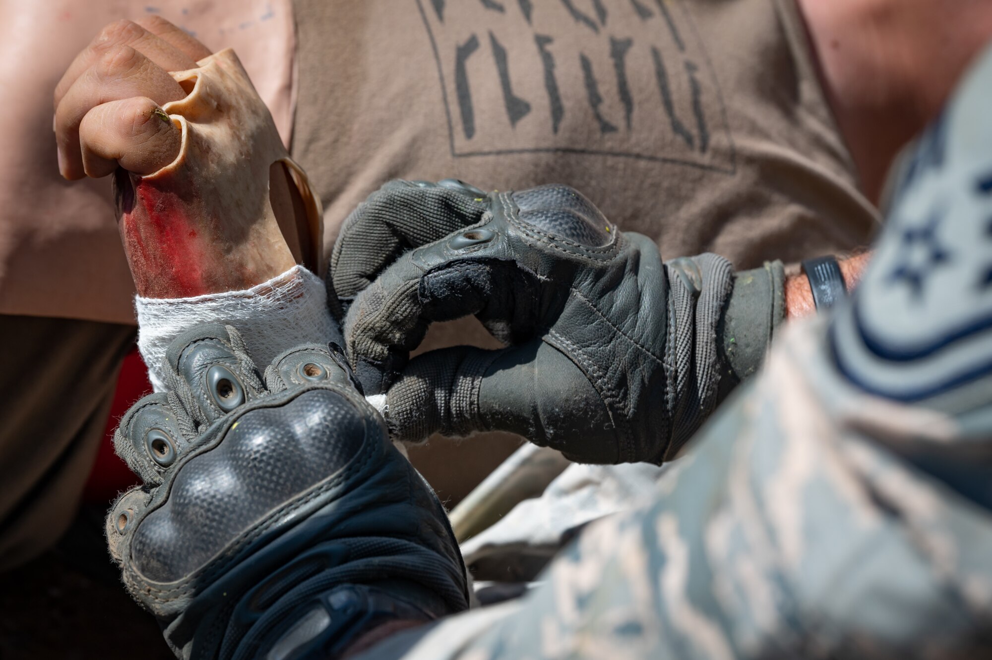 Reserve Citizen Airmen of the 944th Fighter Wing’s Aeromedical Staging Squadron conduct Tactical Combat Casualty Care (TCCC) training at Luke Air Force Base, Ariz., May 8, 2024, during their 2-week annual tour. The Air Force's announcement, earlier this year, outlined a focus on developing people, generating readiness, and projecting power, with a notable shift toward hands-on, realistic training environments.